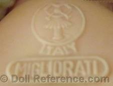 Migliorati doll mark a girl symbol holding an initial M